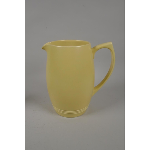 98 - Keith Murray for Wedgwood, yellow glazed matching jug and mug, 21cm high