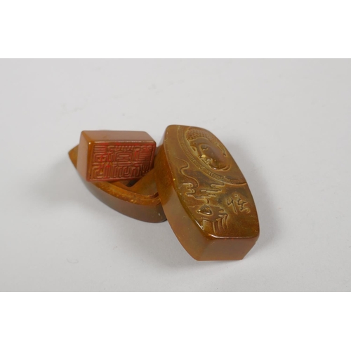 99 - A Chinese amber soapstone seal in a matching soapstone box, with carved Buddha decoration to cover, ... 