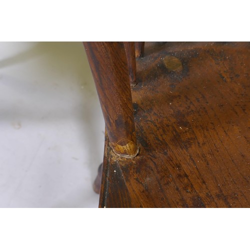 1010 - C19th Windsor wheelback elbow chair with shaped elm seat, raised on turned supports, and another sim... 