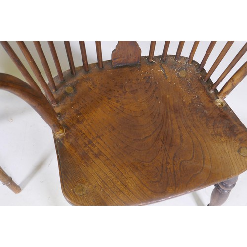 1010 - C19th Windsor wheelback elbow chair with shaped elm seat, raised on turned supports, and another sim... 