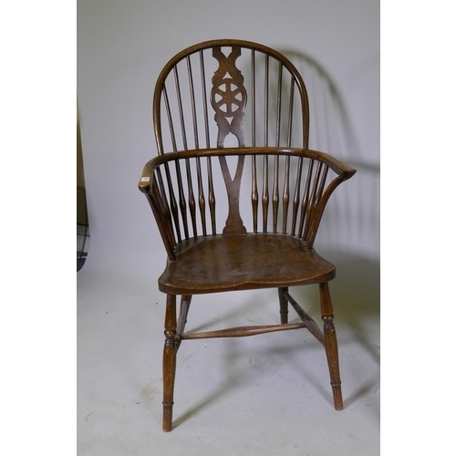 1010 - C19th Windsor wheelback elbow chair with shaped elm seat, raised on turned supports, and another sim... 