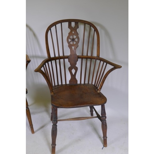 1010 - C19th Windsor wheelback elbow chair with shaped elm seat, raised on turned supports, and another sim... 