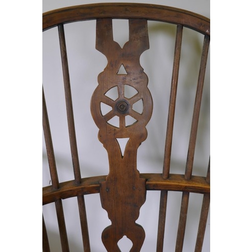 1010 - C19th Windsor wheelback elbow chair with shaped elm seat, raised on turned supports, and another sim... 