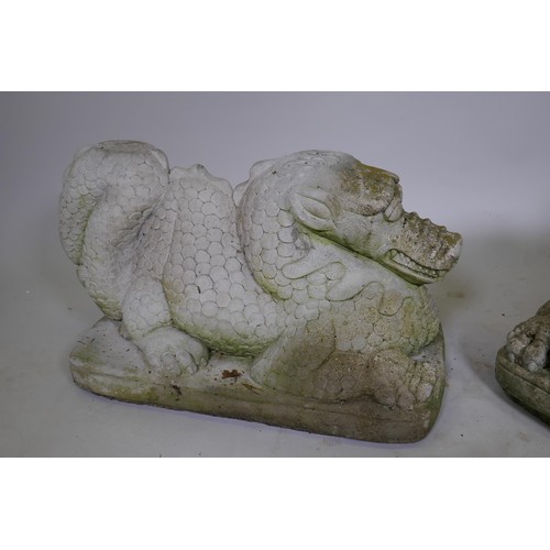 1081 - A pair of reconstituted stone dragons signed Helen Young, 54 x 34cm