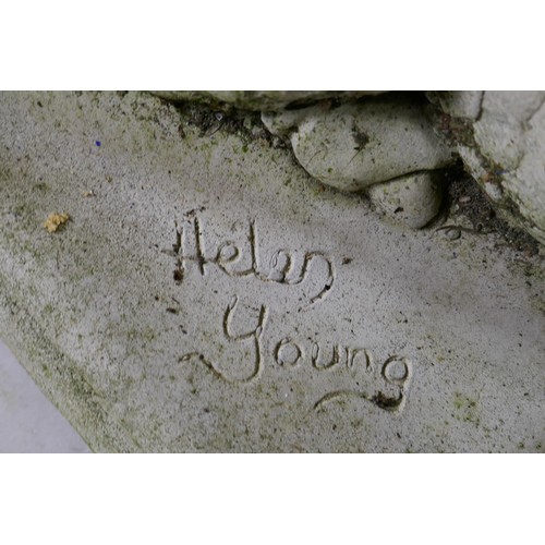 1081 - A pair of reconstituted stone dragons signed Helen Young, 54 x 34cm