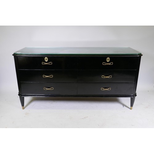 1122 - A mid century Continental black lacquer six drawer commode, the top with moulded edge over two fligh... 