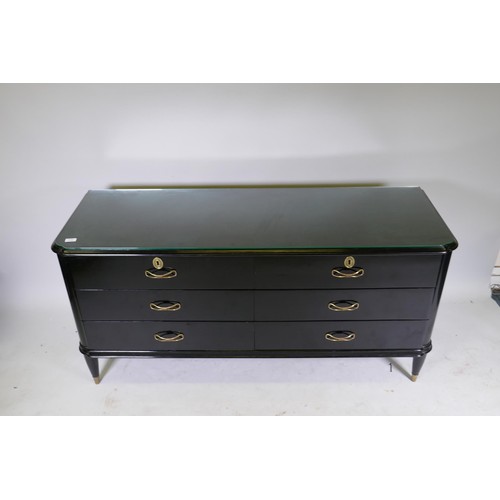 1122 - A mid century Continental black lacquer six drawer commode, the top with moulded edge over two fligh... 