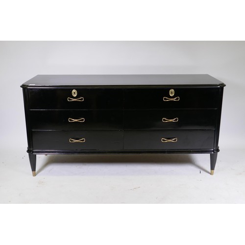 1122 - A mid century Continental black lacquer six drawer commode, the top with moulded edge over two fligh... 