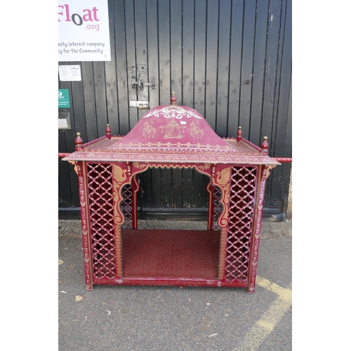 1143 - An Indian palanquin/sedan chair with painted and applied decoration and open fretwork sides, 137 x 9... 