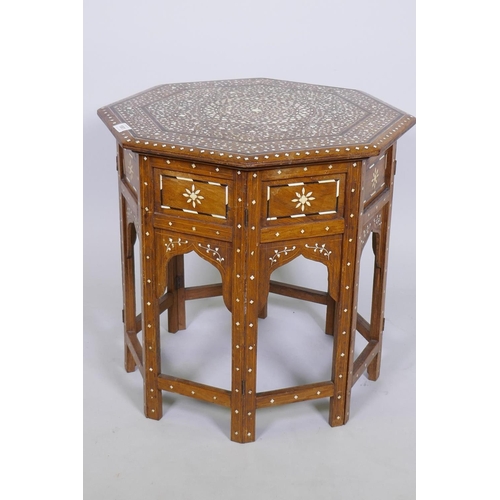 1001 - Anglo Indian ebony and ivory inlaid table, with octagonal top and folding base, 51cm diameter, 52cm ... 