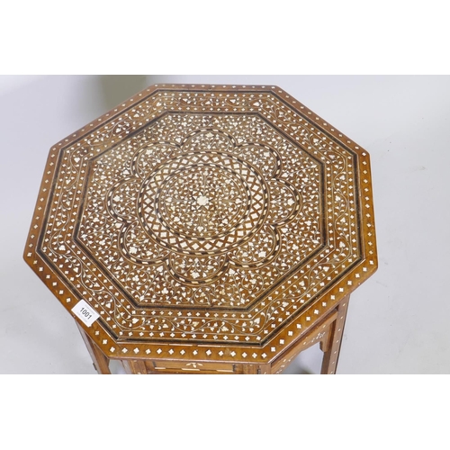 1001 - Anglo Indian ebony and ivory inlaid table, with octagonal top and folding base, 51cm diameter, 52cm ... 