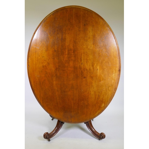 1009 - A good Victorian mahogany tilt top and swivel breakfast table, with shaped frieze raised on a turned... 