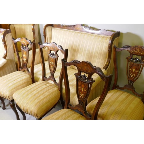 1015 - A Victorian inlaid mahogany parlour suite, a two seater settee, two armchairs and four side chairs