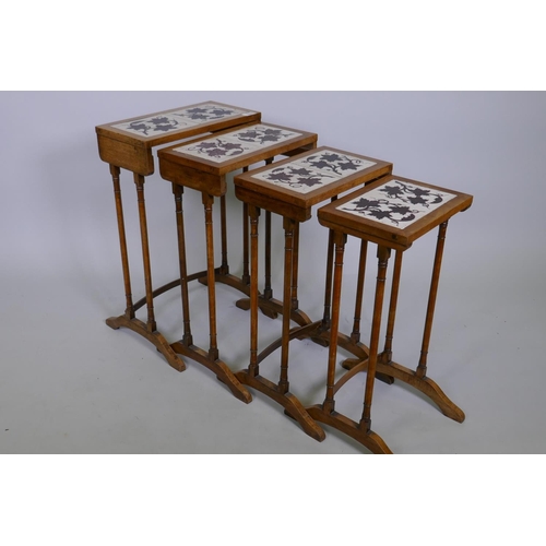 1020 - A quartetto 'nest' of four C19th faded rosewood tables, the tops inset with antique ceramic tiles de... 