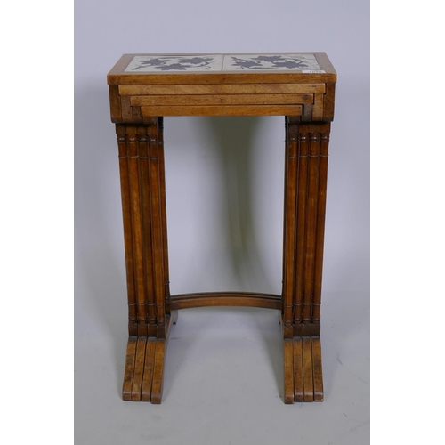 1020 - A quartetto 'nest' of four C19th faded rosewood tables, the tops inset with antique ceramic tiles de... 