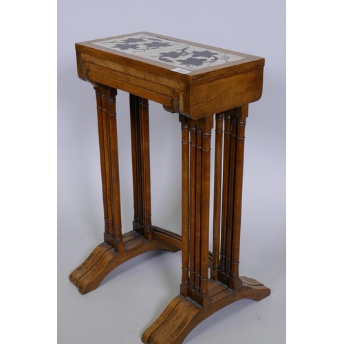 1020 - A quartetto 'nest' of four C19th faded rosewood tables, the tops inset with antique ceramic tiles de... 