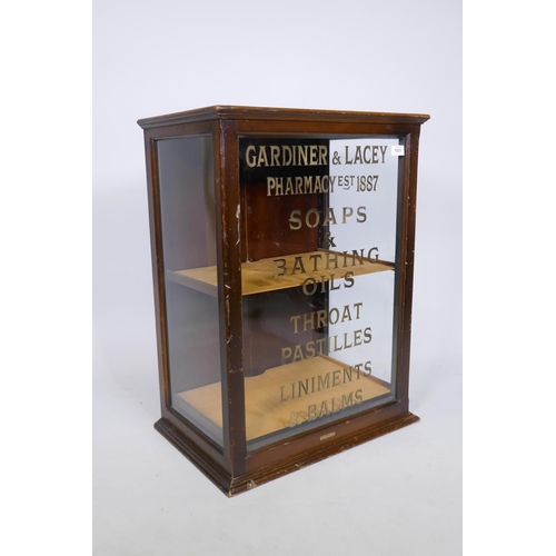 1021 - A mahogany shop display cabinet labelled T B Ford, Loudwater, Bucks, with sign written decoration, d... 