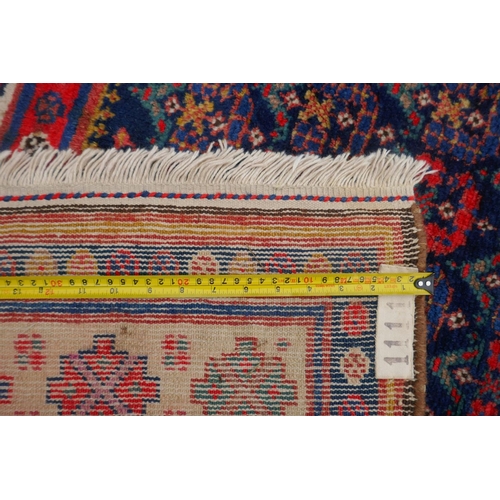 1023 - An antique Persian blue ground Malayer Farahan Kalleh rug, with hand spun wool and natural dyes, dec... 