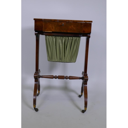 1025 - An early C19th figured mahogany work table, the top opening to reveal a lift out fitted tray over a ... 