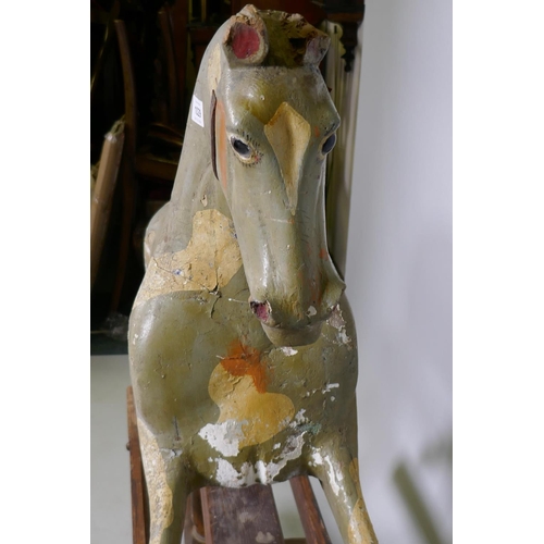 1029 - An antique painted pine dapple grey rocking horse on a trestle base, lacks mane, tail and bolts, 122... 