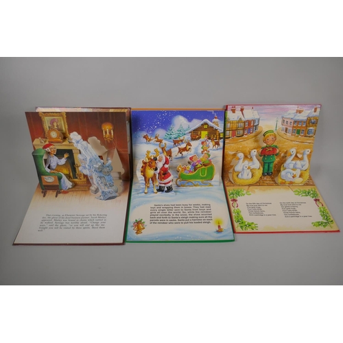 104 - A collection of vintage children's Christmas pop-up books and picture books including The Night Befo... 