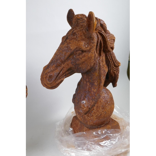 1046 - A pair of rusted cast iron horse heads, 45cm high