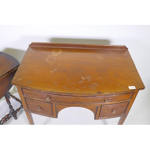 1054 - C19th mahogany bow front knee hole dressing/writing table with three drawers and brass handles, rais... 