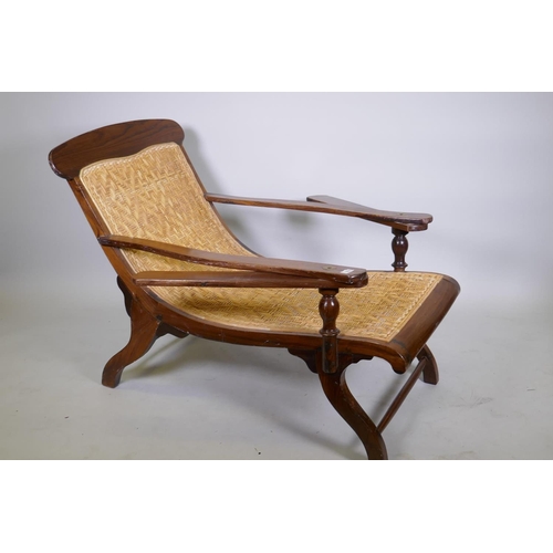 1055 - A rosewood and caned plantation day bed