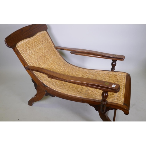 1055 - A rosewood and caned plantation day bed