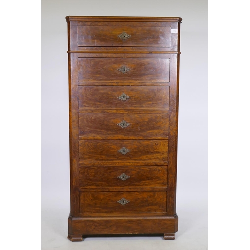 1058 - A C19th French walnut seven drawer semainier chest with canted corners and brass escutcheons, 73 x 4... 