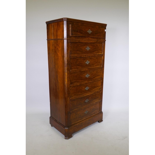 1058 - A C19th French walnut seven drawer semainier chest with canted corners and brass escutcheons, 73 x 4... 