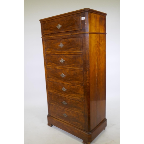 1058 - A C19th French walnut seven drawer semainier chest with canted corners and brass escutcheons, 73 x 4... 