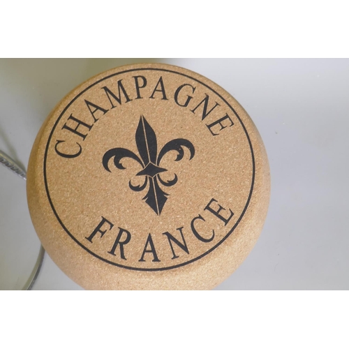 1059 - A pair of cork and metal stools in the form of champagne corks, 61cm high