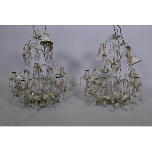 1063 - A pair of French style painted and parcel gilt metal five branch chandeliers with lustre drops, 54cm... 