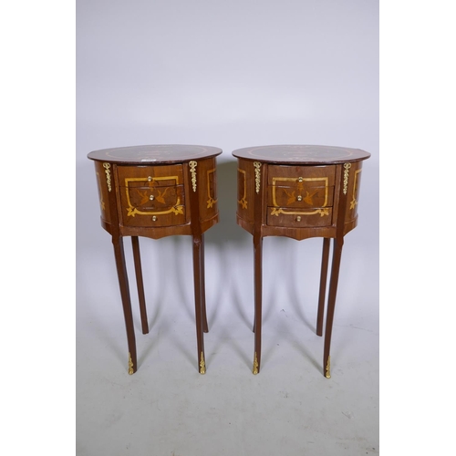 1064 - A pair of Louis XV style marquetry inlaid lamp tables with ormolu mounts and three drawers, 71cm hig... 