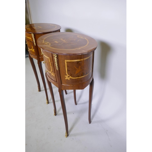 1064 - A pair of Louis XV style marquetry inlaid lamp tables with ormolu mounts and three drawers, 71cm hig... 