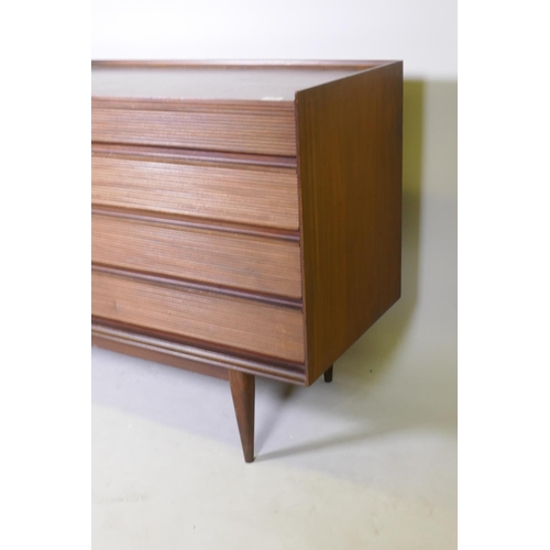 1068 - A mid century Richard Hornby for Heals afromosia side board with four drawers and two cupboards, rai... 