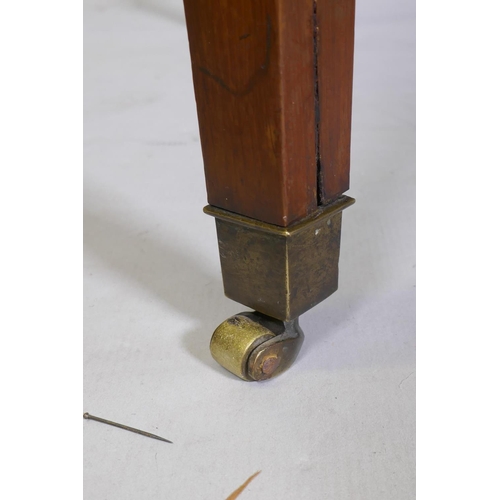 1069 - An antique yew wood oval centre table, with sunburst veneer top, the frieze with brass edge and rais... 