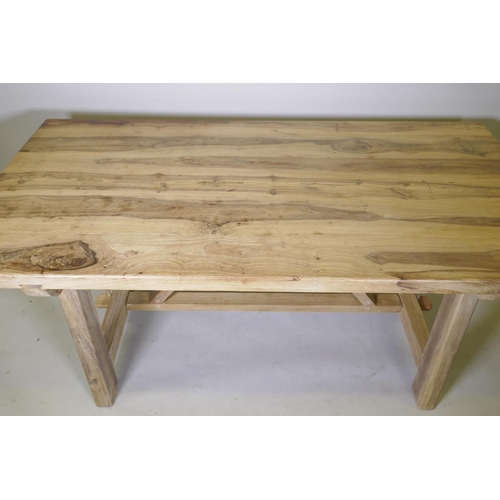 1077 - A bespoke hardwood tavern type dining table, with planked top and refectory style base united by a s... 