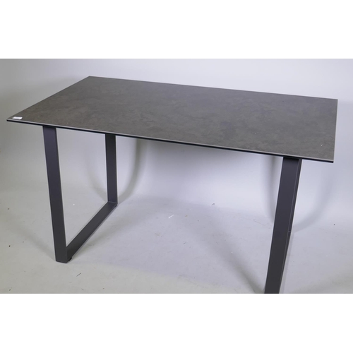 1082 - A Barker & Stonehouse dining table, with glass and ceramic top, raised on a painted metal base, ... 