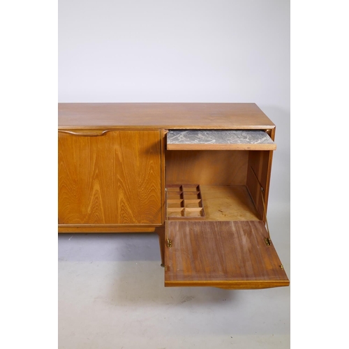 1098 - A mid century McIntosh & Co teak sideboard with three doors and a flight of three graduated draw... 