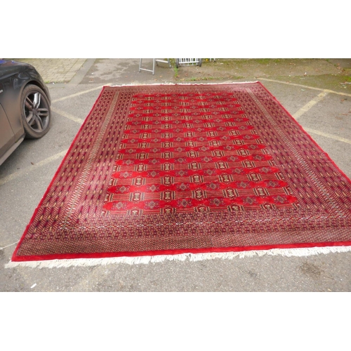 1101 - A Turkman fine red ground Bokhara rug, 290 x 360cm