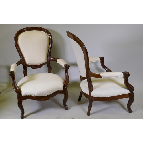 1121 - A pair of antique French Louis Philippe style show frame mahogany arm chairs, raised on cabriole sup... 