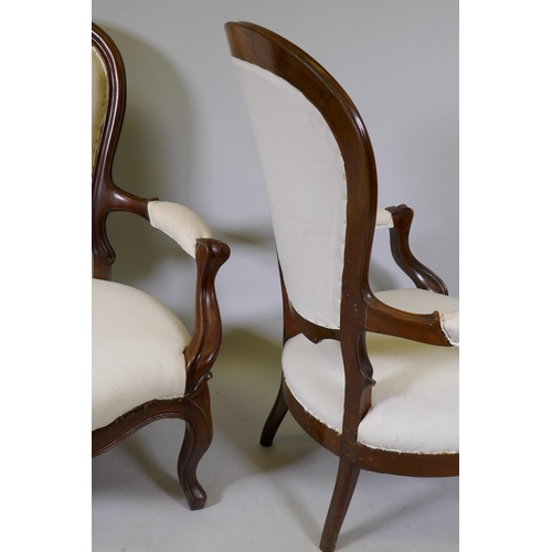 1121 - A pair of antique French Louis Philippe style show frame mahogany arm chairs, raised on cabriole sup... 