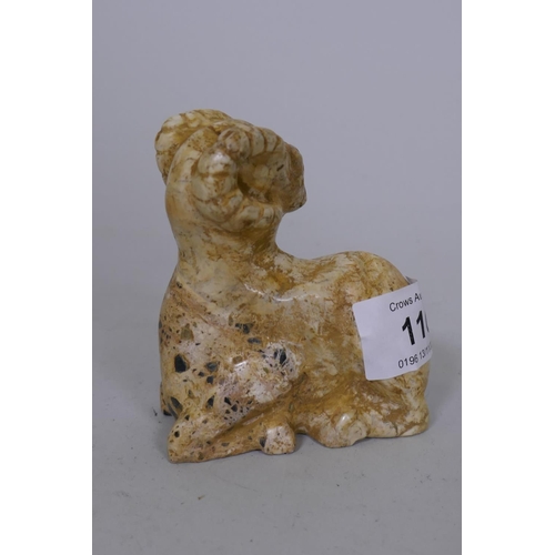 116 - A Middle Eastern hardstone carving of a ram, 8cm high