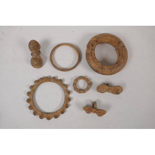 120 - A quantity of antique bronze African jewellery to include a cash bangle and rings