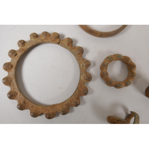 120 - A quantity of antique bronze African jewellery to include a cash bangle and rings