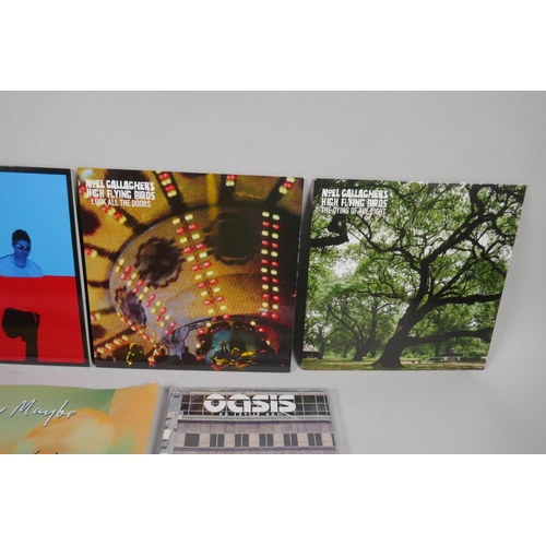 121 - A collection of Oasis related ephemera to include four original CD singles, Cigarettes and Alcohol, ... 