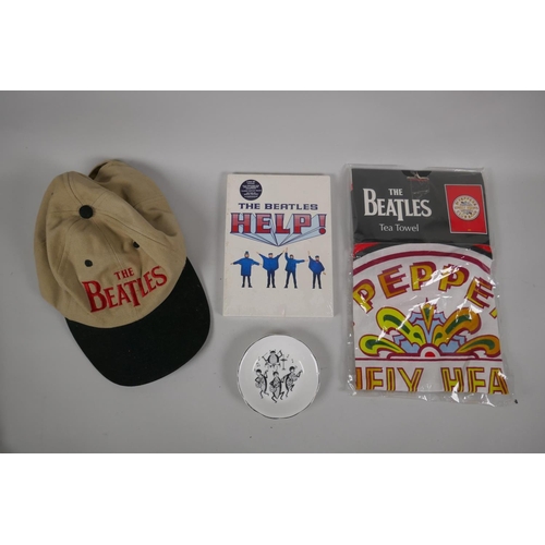 122 - Beatles memorabilia, a Grafton bone china dish, a Sgt Pepper's Lonely Hearts tea towel, a two disk D... 