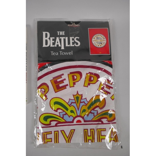 122 - Beatles memorabilia, a Grafton bone china dish, a Sgt Pepper's Lonely Hearts tea towel, a two disk D... 